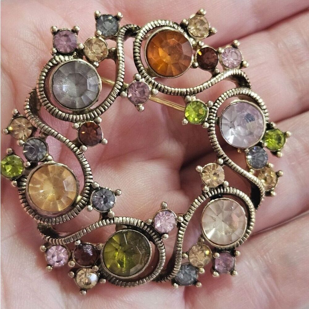 Monet gold tone round brooch